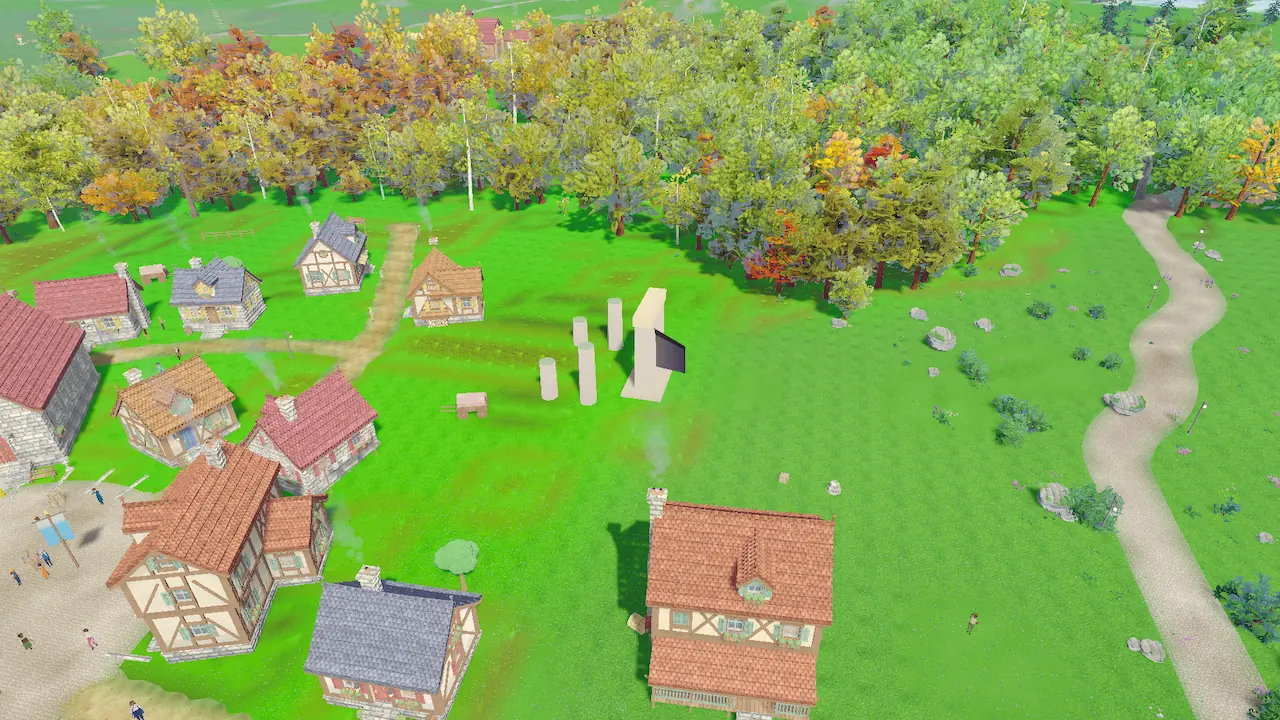 A ring of standing stones in a bright meadow next to a village, with autumn-coloured woods behind.
