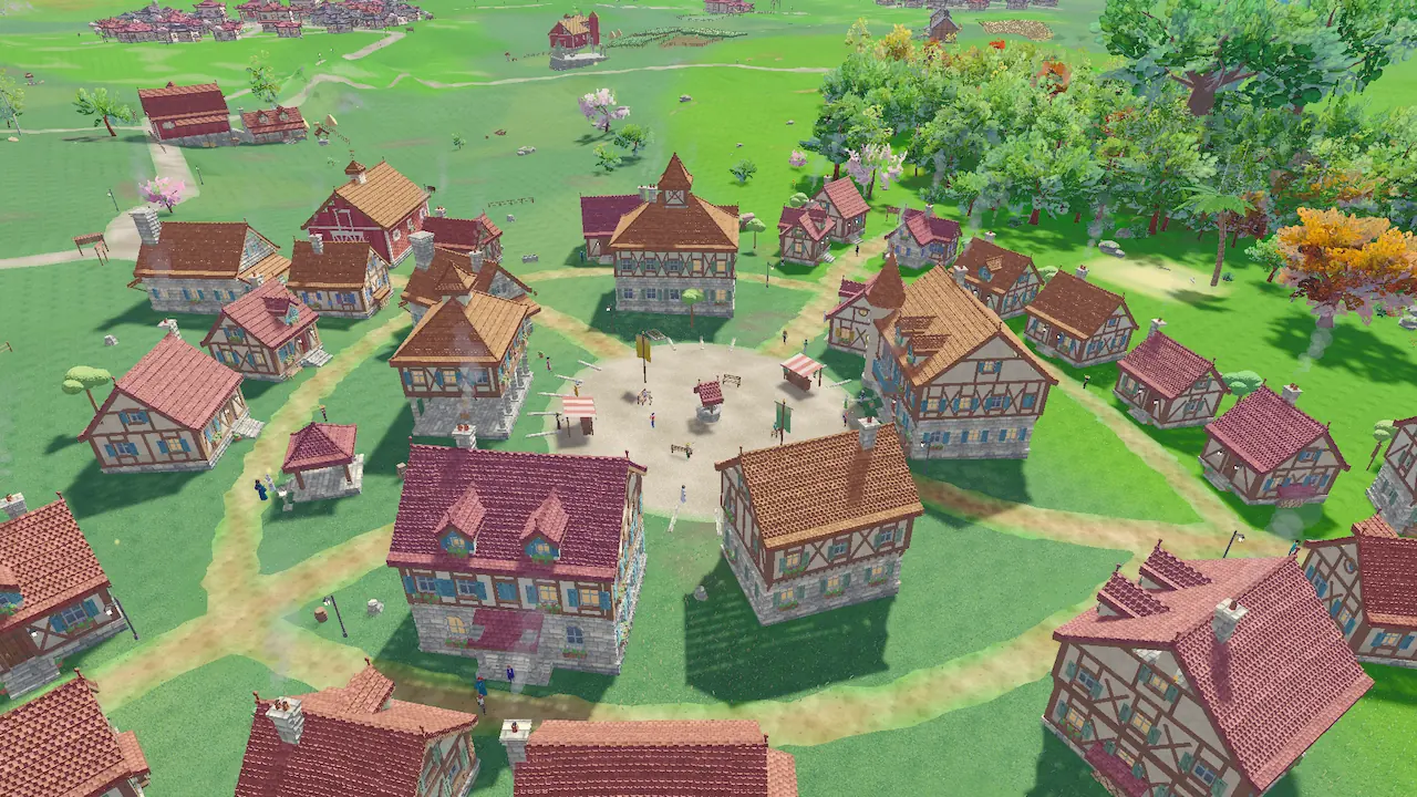 A village from above: red and orange roofs around a round market square, paths leading out into green fields.